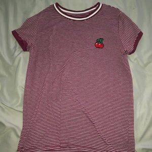 small red and white striped shirt with a patch